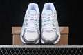 Baskets running blanches et vertes pour homme